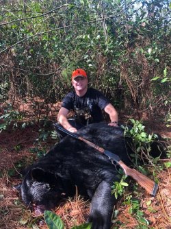 Christopher with Bear he shot with my 45-70.jpg